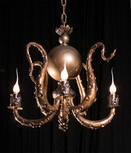 Adam  Wallacavage -  <strong>Small Gold Chandelier</strong> (2013<strong style = 'color:#635a27'></strong>)<bR /> lamp parts, epoxy clay, epoxy resin, spray paint, 
 18 x 19 inches 
(45.72 x 48.26 cm)