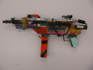 BAST -  <strong>Machine Gun</strong> (2013<strong style = 'color:#635a27'></strong>)<bR /> mixed media
12 x 25 x 2 1/2 in.