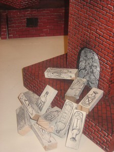 Andrew  Schoultz -  <strong>Untitled Installation</strong> (2006<strong style = 'color:#635a27'></strong>)<bR /> Mixed media with hand sculpted buildings and figures, 
 Dimensions variable