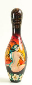 Kirsten  Easthope -  <strong>South Sea Beauty</strong> (<strong style = 'color:#635a27'></strong>)<bR /> acrylic on bowling pin, 
 15 1/2 x 4 in. (39.37 x 10.16 cm)