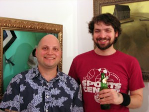 Scope Fair -  <strong>Levine and Weiner</strong> (<strong style = 'color:#635a27'></strong>)<bR /> Jonathan LeVine and Jonathan Weiner in front of Weiner's paintings at Scope