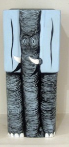 Andrew  Schoultz -  <strong>Small Elephant</strong> (2006<strong style = 'color:#635a27'></strong>)<bR /> Hand-Carved and Painted, 
 Acrylic on Wood Sculpture, 
 10 x 4 x 4 inches