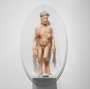 Mike Leavitt -  <strong>David Lynch</strong> (2016<strong style = 'color:#635a27'></strong>)<bR /> hand-carved western red cedar, fimo, sculpey polymer clay and acrylic paint,
18 inches (45.7 cm)