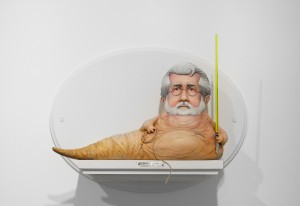 Mike Leavitt -  <strong>George Lucas</strong> (2016<strong style = 'color:#635a27'></strong>)<bR /> hand-carved western red cedar, yellow cedar and acrylic paint,
18 inches (45.7 cm)