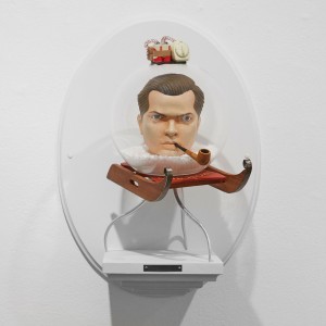Mike Leavitt -  <strong>Orson Welles</strong> (2016<strong style = 'color:#635a27'></strong>)<bR /> hand-carved western red cedar, douglass fir, white pine, aluminum rails, acrylic globe and acrylic paint,
18 inches (45.7 cm)