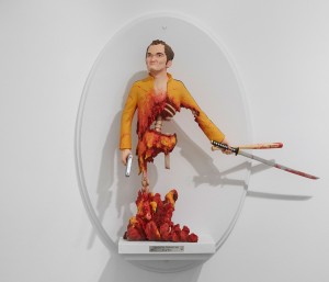 Mike Leavitt -  <strong>Quentin Tarantino</strong> (2016<strong style = 'color:#635a27'></strong>)<bR /> hand-carved western red cedar, white pine, fimo, sculpey polymer clay and acrylic paint,
18 inches (45.7 cm)
