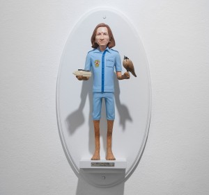 Mike Leavitt -  <strong>Wes Anderson</strong> (2016<strong style = 'color:#635a27'></strong>)<bR /> hand-carved western red cedar, fimo, sculpey polymer clay and acrylic paint,
18 inches (45.7 cm)