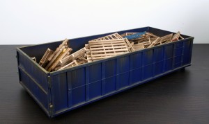 Drew Leshko -  <strong>Blue 30 Yard Dumpster with 55 Pallets (side)</strong> (2016<strong style = 'color:#635a27'></strong>)<bR /> paper, enamel, acrylic, dry pigments, wire, wood,
5 x 21.5 x 9 inches,
(12.7 x 54.61 x 22.86 cm)
