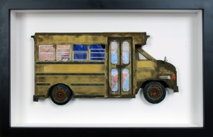 Drew Leshko -  <strong>Small School Bus</strong> (2016<strong style = 'color:#635a27'></strong>)<bR /> paper, enamel, dry pigments, acrylic, plastic, wire, clay, inkjet prints, toy hubcaps. Framed in shadowbox without glass,
16 x 24.62 x 3 inches,
(40.64 x 62.53 x 7.62 cm)
<strong>SOLD</strong>