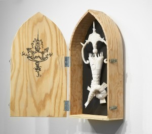 Gary Mellon -  <strong>#17 (side)</strong> (2016<strong style = 'color:#635a27'></strong>)<bR /> carved cow bone and wood in wood box,
21 x 6 x 3 inches,
(53.34 x 15.24 x 7.62 cm)
box: 25.5 x 13.75 x 6 inches,
(64.77 x 34.92 x 15.24 cm)
