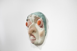 Paolo Del Toro -  <strong>Baba Yaga (side)</strong> (2016<strong style = 'color:#635a27'></strong>)<bR /> sculpted Styrofoam core covered with hand-dyed needle felted merino wool,
26 x 26 x 8 inches,
(66 x 66 x 20.3 cm)