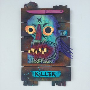 Charles Bennett -  <strong>Killer Mullett</strong> (2017<strong style = 'color:#635a27'></strong>)<bR /> acrylic and spray paint on reclaimed wood,
21.2 x 21.6 x 1 inches,
$700