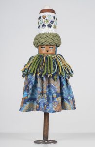 Koralie -  <strong>Eleoranus (God of Wind and Sky)</strong> (2018<strong style = 'color:#635a27'></strong>)<bR /> porcelain, wood, fabric and metal,
16 x 8 inches
$500
