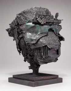 Ronald Gonzalez -  <strong>Head</strong> (2017<strong style = 'color:#635a27'></strong>)<bR /> manipulated found objects, wax, wire, soot, metal filings over welded steel, 	
11.5 x 8 x 8 inches
$2,250