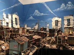 Jeff Gillette -  <strong>Hollywood Hood</strong> (2017<strong style = 'color:#635a27'></strong>)<bR /> found materials from the Mojave Desert, collected refuse and re-purposed paintings,
signed and numbered series of 300