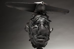 Ronald Gonzalez -  <strong>Black Wings (detail)</strong> (2018<strong style = 'color:#635a27'></strong>)<bR /> black leather, found objects, wire, wax, carbon, screws and metal filings over welded steel armatures, 
14 x 19 x 13 inches