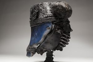 Ronald Gonzalez -  <strong>Black and Blue (side)</strong> (2018<strong style = 'color:#635a27'></strong>)<bR /> black leather, found objects, wire, wax, carbon, screws and metal filings over welded steel armatures,  	
12 x 11 x 11 inches