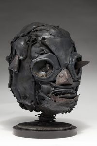 Ronald Gonzalez -  <strong>Daggers (side)</strong> (2018<strong style = 'color:#635a27'></strong>)<bR /> black leather, found objects, wire, wax, carbon, screws and metal filings over welded steel armatures,
11 x 9 x 10 inches