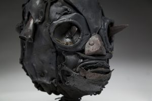Ronald Gonzalez -  <strong>Daggers (detail)</strong> (2018<strong style = 'color:#635a27'></strong>)<bR /> black leather, found objects, wire, wax, carbon, screws and metal filings over welded steel armatures,
11 x 9 x 10 inches