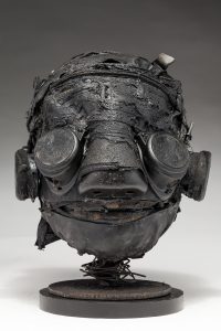 Ronald Gonzalez -  <strong>Darkly</strong> (2018<strong style = 'color:#635a27'></strong>)<bR /> black leather, found objects, wire, wax, carbon, screws and metal filings over welded steel armatures,
12 x 10 x 9 inches