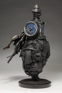Ronald Gonzalez -  <strong>Dead Air (side)</strong> (2018<strong style = 'color:#635a27'></strong>)<bR /> black leather, found objects, wire, wax, carbon, screws and metal filings over welded steel armatures,
18 x 10 x 8 inches