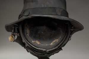 Ronald Gonzalez -  <strong>Eye (detail)</strong> (2018<strong style = 'color:#635a27'></strong>)<bR /> black leather, found objects, wire, wax, carbon, screws and metal filings over welded steel armatures,
12 x 11 x 11 inches