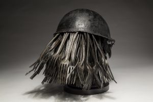 Ronald Gonzalez -  <strong>Feeding (side)</strong> (2018<strong style = 'color:#635a27'></strong>)<bR /> black leather, found objects, wire, wax, carbon, screws and metal filings over welded steel armatures.  	
12 x 11 x 11 inches