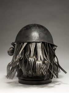 Ronald Gonzalez -  <strong>Feeding</strong> (2018<strong style = 'color:#635a27'></strong>)<bR /> black leather, found objects, wire, wax, carbon, screws and metal filings over welded steel armatures.  	
12 x 11 x 11 inches