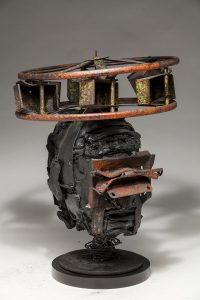 Ronald Gonzalez -  <strong>Halo (side)</strong> (2018<strong style = 'color:#635a27'></strong>)<bR /> black leather, found objects, wire, wax, carbon, screws and metal filings over welded steel armatures,
14 x 12 x 12 inches