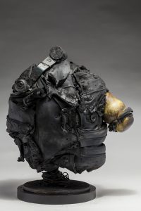Ronald Gonzalez -  <strong>Hitch (side)</strong> (2018<strong style = 'color:#635a27'></strong>)<bR /> black leather, found objects, wire, wax, carbon, screws and metal filings over welded steel armatures,
13 x 8 x 12 inches