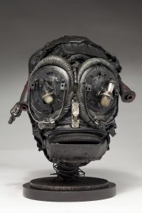 Ronald Gonzalez -  <strong>Insect</strong> (2018<strong style = 'color:#635a27'></strong>)<bR /> black leather, found objects, wire, wax, carbon, screws and metal filings over welded steel armatures,
11 x 8 x 8 inches
