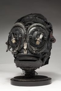 Ronald Gonzalez -  <strong>Insect (side)</strong> (2018<strong style = 'color:#635a27'></strong>)<bR /> black leather, found objects, wire, wax, carbon, screws and metal filings over welded steel armatures,
11 x 8 x 8 inches