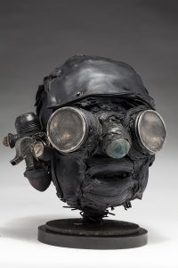 Ronald Gonzalez -  <strong>Searchlights (side)</strong> (2018<strong style = 'color:#635a27'></strong>)<bR /> black leather, found objects, wire, wax, carbon, screws and metal filings over welded steel armatures,
11 x 9 x 10 inches