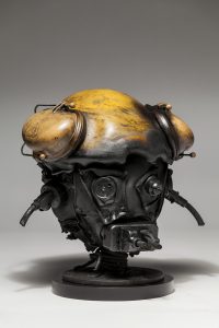 Ronald Gonzalez -  <strong>Suddenly Shocked (side)</strong> (2018<strong style = 'color:#635a27'></strong>)<bR /> black leather, found objects, wire, wax, carbon, screws and metal filings over welded steel armatures,
12 x 13 x 12 inches