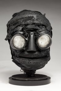 Ronald Gonzalez -  <strong>Whites</strong> (2018<strong style = 'color:#635a27'></strong>)<bR /> black leather, found objects, wire, wax, carbon, screws and metal filings over welded steel armatures,
11 x 7 x 8 inches