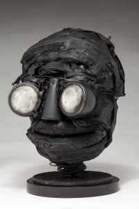Ronald Gonzalez -  <strong>Whites (side)</strong> (2018<strong style = 'color:#635a27'></strong>)<bR /> black leather, found objects, wire, wax, carbon, screws and metal filings over welded steel armatures,
11 x 7 x 8 inches