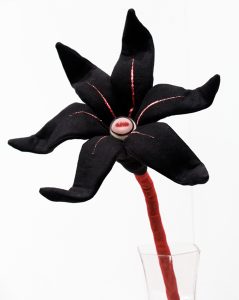 Tara  McPherson -  <strong>The Day's Eye (Black with Red)</strong> (2010<strong style = 'color:#635a27'></strong>)<bR /> suede microfiber, bamboo fiber, polyfil, wire and glass eye, 
 20 x 9 x 6.5 inches 
(50.8 x 22.86 x 16.51 cm)