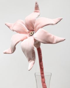 Tara  McPherson -  <strong>The Day's Eye (Pink)</strong> (2010<strong style = 'color:#635a27'></strong>)<bR /> stretch velvet, bamboo fiber, polyfil, wire and glass eye, 
 20 x 9 x 6.5 inches 
(50.8 x 22.86 x 16.51 cm)
