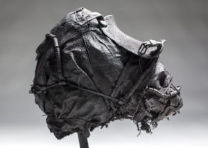 Ronald Gonzalez -  <strong>BLINDER</strong> (2017<strong style = 'color:#635a27'></strong>)<bR /> 15 x 8 x 14. Leather, found objects, wire, wax, carbon, screws, and metal filings over welded steel armatures.