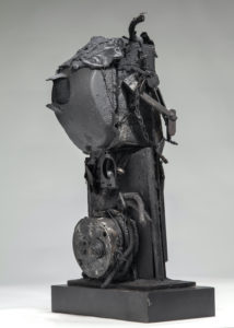 Ronald Gonzalez -  <strong>DEADEYE</strong> (2017<strong style = 'color:#635a27'></strong>)<bR /> 20 x 13 x 9. Leather, found objects, wire, wax, carbon, screws, and metal filings over welded steel armatures.