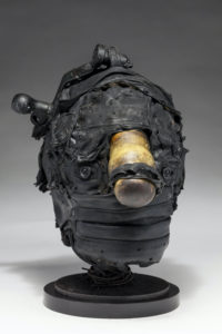 Ronald Gonzalez -  <strong>HITCH</strong> (2017<strong style = 'color:#635a27'></strong>)<bR /> 12 x 8 x 8. Leather, found objects, wire, wax, carbon, screws, and metal filings over welded steel armatures
