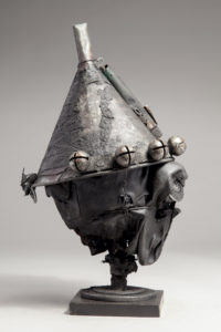 Ronald Gonzalez -  <strong>JESTER</strong> (2018<strong style = 'color:#635a27'></strong>)<bR /> 17 x 9 x 9. Leather, found objects, wire, wax, carbon, screws, and metal filings over welded steel armatures.