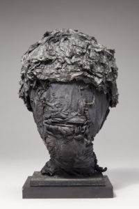 Ronald Gonzalez -  <strong>MEMENTO MORI 2</strong> (2017<strong style = 'color:#635a27'></strong>)<bR /> 11 x 7 x 7. Leather, found objects, wire, wax, carbon, screws, and metal filings over welded steel armatures.