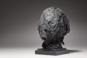Ronald Gonzalez -  <strong>MEMENTO MORI 1</strong> (2017<strong style = 'color:#635a27'></strong>)<bR /> 11 x 7 x 7. Leather, found objects, wire, wax, carbon, screws, and metal filings over welded steel armatures.