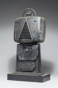 Ronald Gonzalez -  <strong>ROBOT</strong> (2017<strong style = 'color:#635a27'></strong>)<bR /> 13 x 12 x 6. Leather, found objects, wire, wax, carbon, screws, and metal filings over welded steel armatures