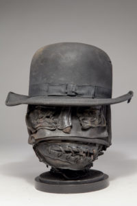 Ronald Gonzalez -  <strong>STITCHES</strong> (2017<strong style = 'color:#635a27'></strong>)<bR /> 13 x 11 x 11. Leather, found objects, wire, wax, carbon, screws, and metal filings over welded steel armatures.