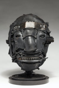 Ronald Gonzalez -  <strong>TUNE</strong> (2018<strong style = 'color:#635a27'></strong>)<bR /> 12 x 8 x 8. Leather, found objects, wire, wax, carbon, screws, and metal filings over welded steel armatures.
