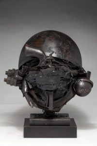 Ronald Gonzalez -  <strong>WAR RELICS # 1</strong> (2018-19<strong style = 'color:#635a27'></strong>)<bR /> Approx. 12 x 11 x 12. Leather, found objects, wire, wax, carbon, screws, and metal filings over welded steel armatures