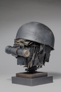 Ronald Gonzalez -  <strong>WAR RELICS # 11</strong> (2018-19<strong style = 'color:#635a27'></strong>)<bR /> Approx. 12 x 11 x 12. Leather, found objects, wire, wax, carbon, screws, and metal filings over welded steel armatures