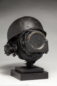 Ronald Gonzalez -  <strong>WAR RELICS # 3</strong> (2018-19<strong style = 'color:#635a27'></strong>)<bR /> Approx. 12 x 11 x 12. Leather, found objects, wire, wax, carbon, screws, and metal filings over welded steel armatures